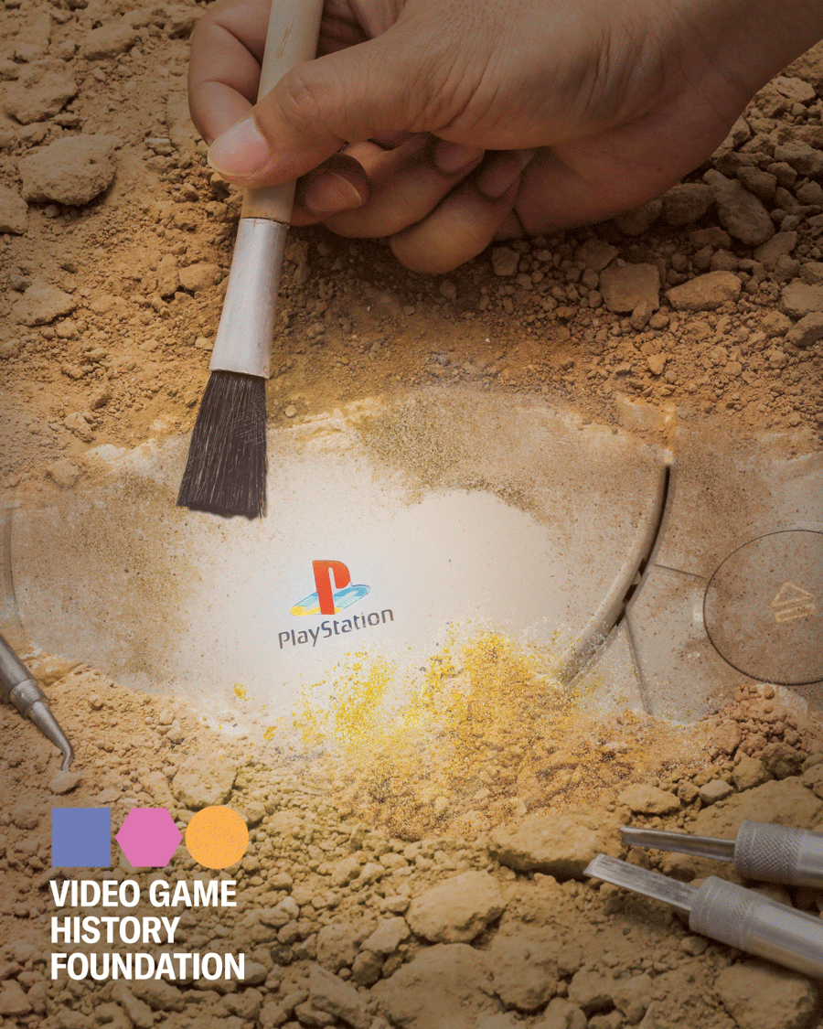 A playstaiton being unearth from desert sand